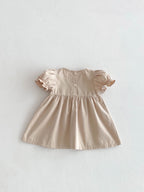 Vestido beige con cuello floral