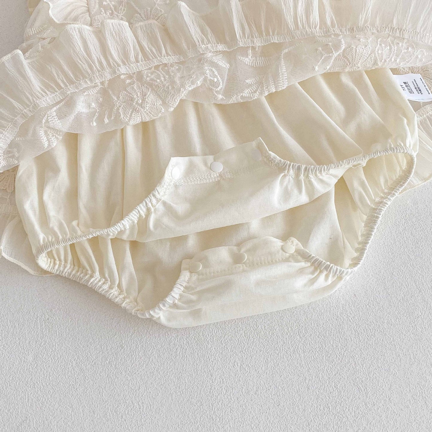 Romper Vestido Ivory Bordado Floral – Encanto Delicado